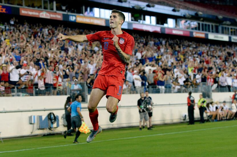 United States midfielder Christian Pulisic celebrates after scoring a goal against Jamaica...