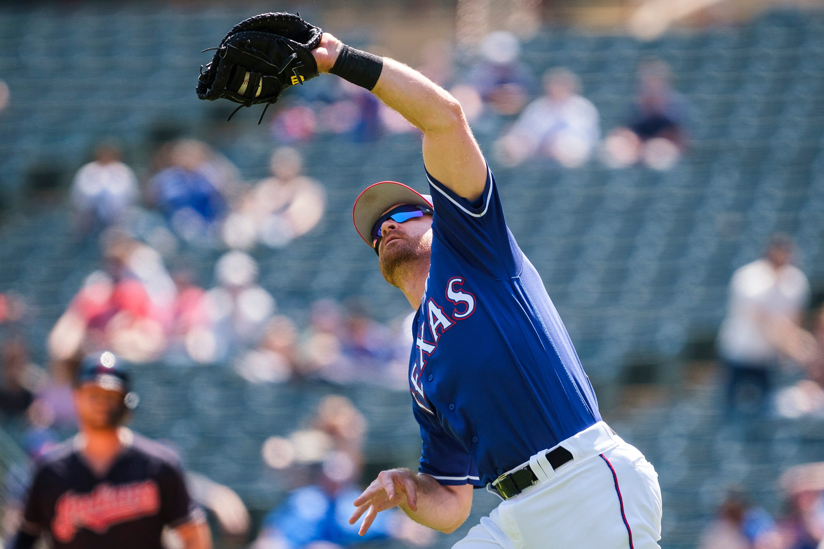 Texas Rangers infielder Logan Forsythe catches a popup off the bat of Cleveland Indians...