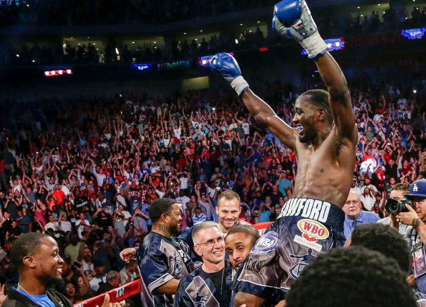 Terence "Bud" Crawford celebrates his win by knockout against Julius Indongo in the third...