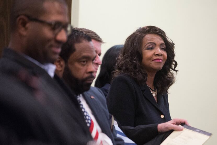 Dallas County District Attorney Faith Johnson listens as one of her staff explains the...