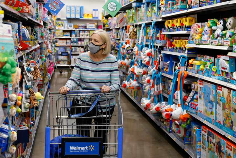 Bonnie Cavin, 71, browses a toy aisle at a Walmart on Retail Road in Dallas on Tuesday, Nov....