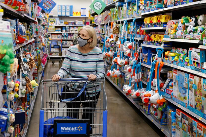Bonnie Cavin, 71, browses a toy aisle at a Walmart on Retail Road in Dallas on Tuesday, Nov....