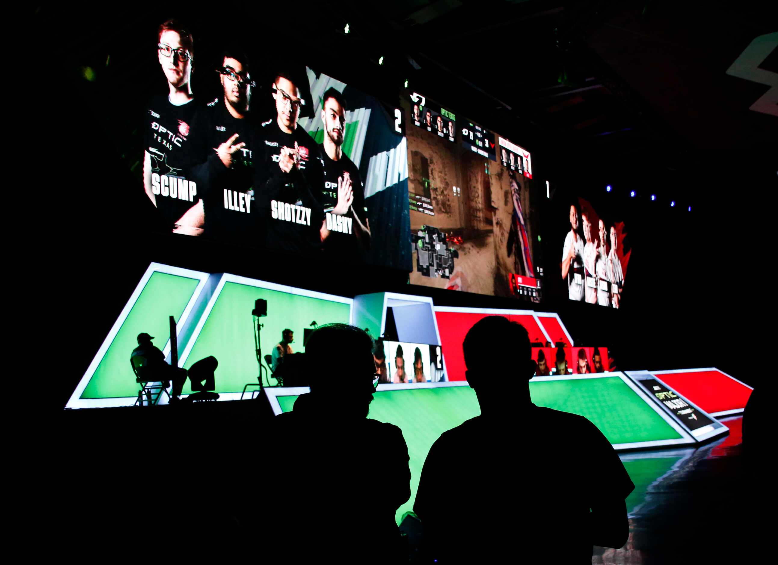 Members of the technical staff look on from the floor during the match between OpTic Texas...