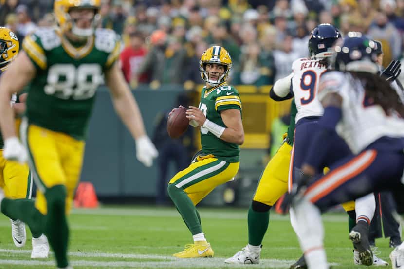 Green Bay Packers quarterback Jordan Love (10) drops back to pass during an NFL football...
