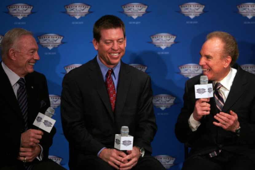 (From right) Roger Staubach, Troy Aikman, and Cowboys owner Jerry Jones share a laugh...