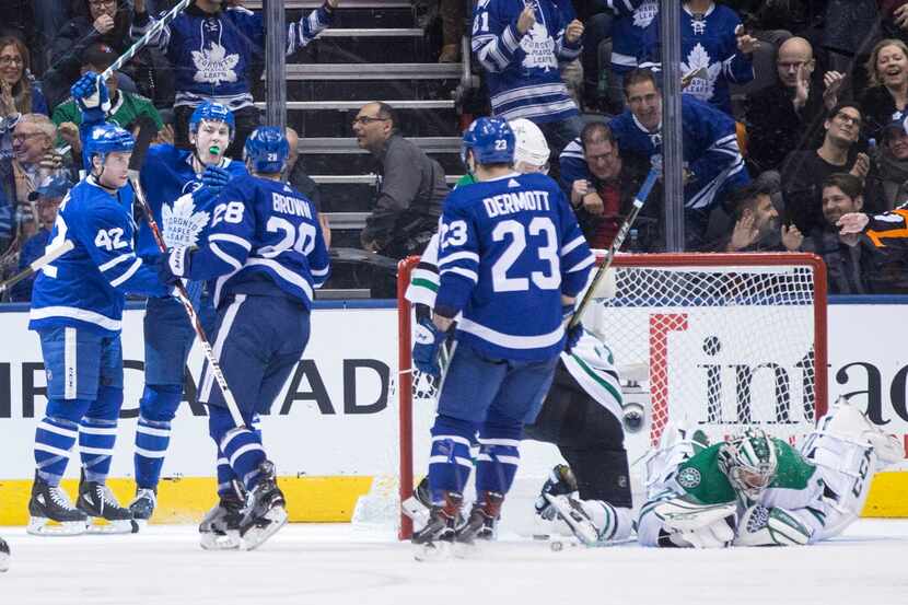 Toronto Maple Leafs left wing James van Riemsdyk, second from left, celebrates with centre...