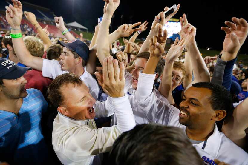 Southern Methodist Mustangs head coach Chad Morris celebrates his upset win over the Houston...