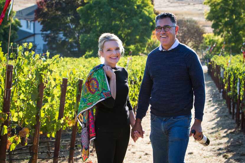 Margaret and Joe Valenzuela stroll through one of Napa Valley's many vineyards. She is...