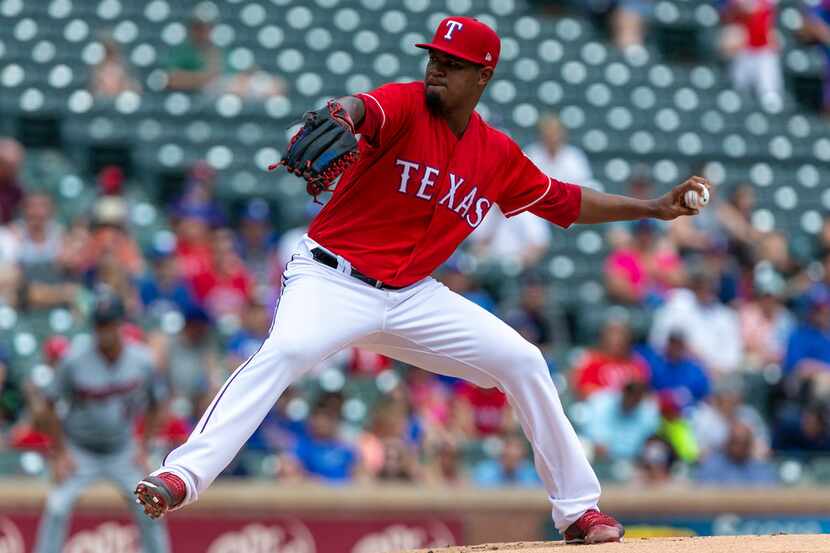 Texas Rangers starting pitcher Yohander Mendez delivers during the first inning of a...