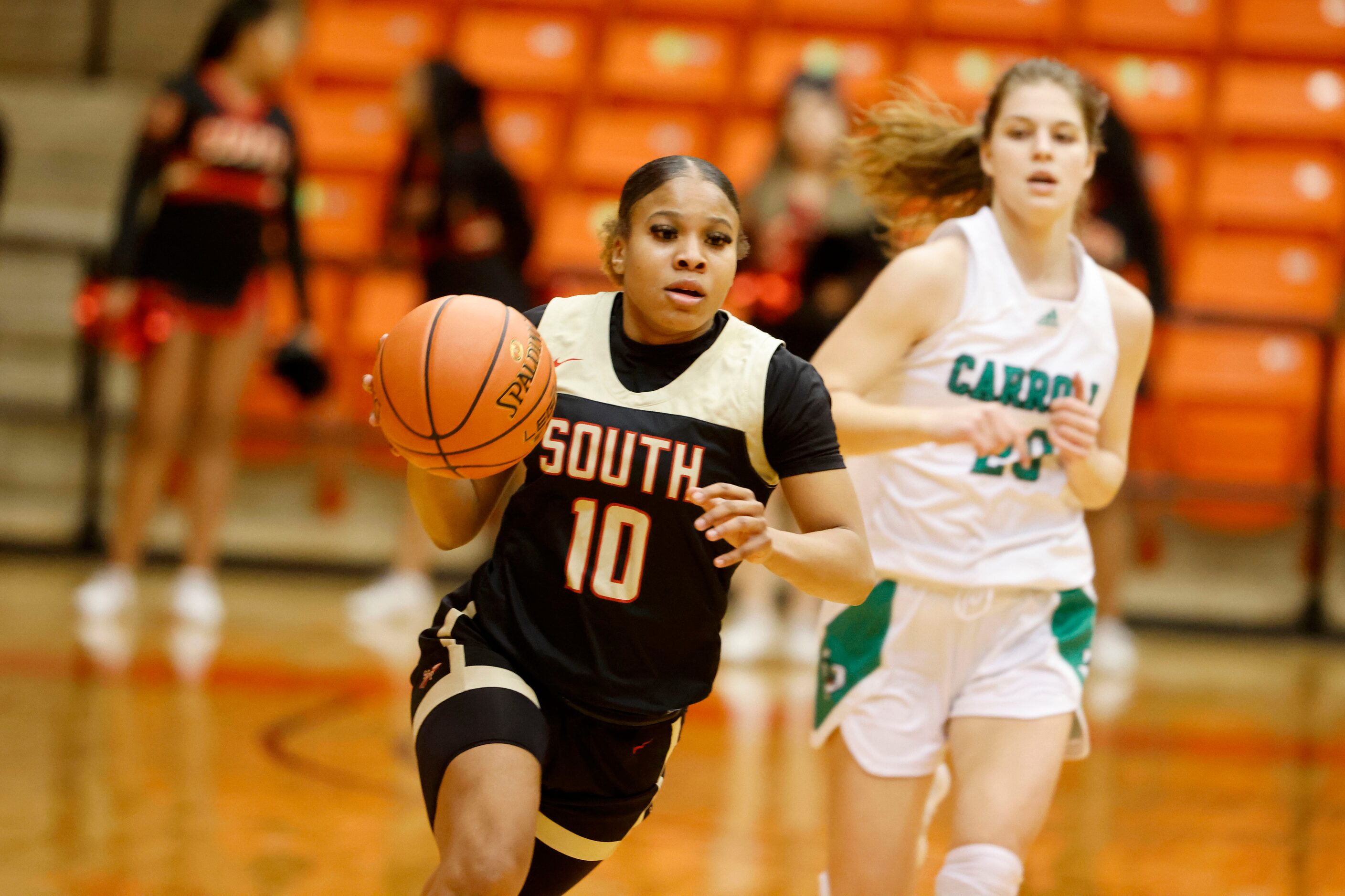 South Grand Prairie’s Victoria Dixon (10) moves the ball up the court against Southlake...