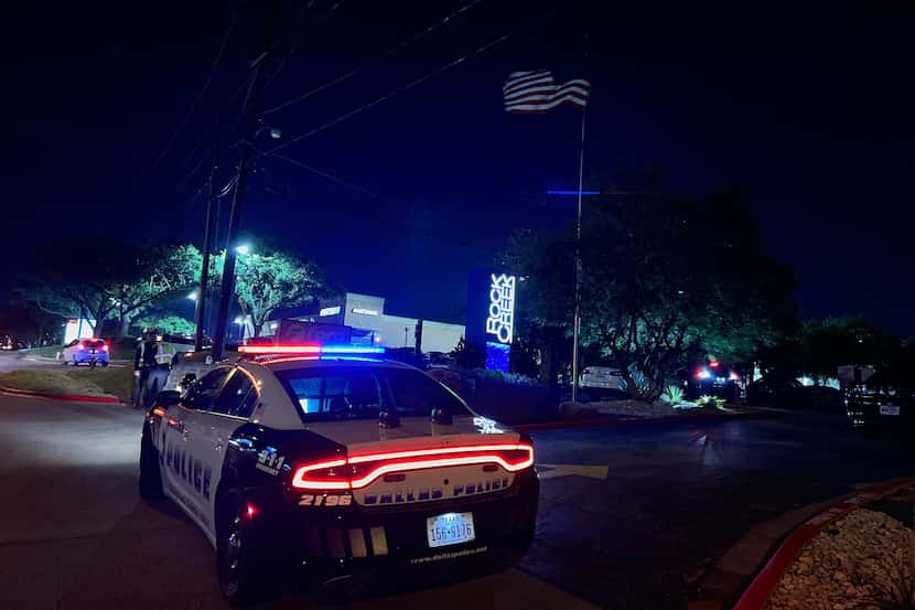 A Dallas police car sits outside the Rock Creek apartment complex in Far North Dallas on...