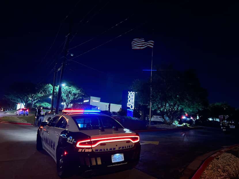 A Dallas police car sits outside the Rock Creek apartment complex in Far North Dallas on...