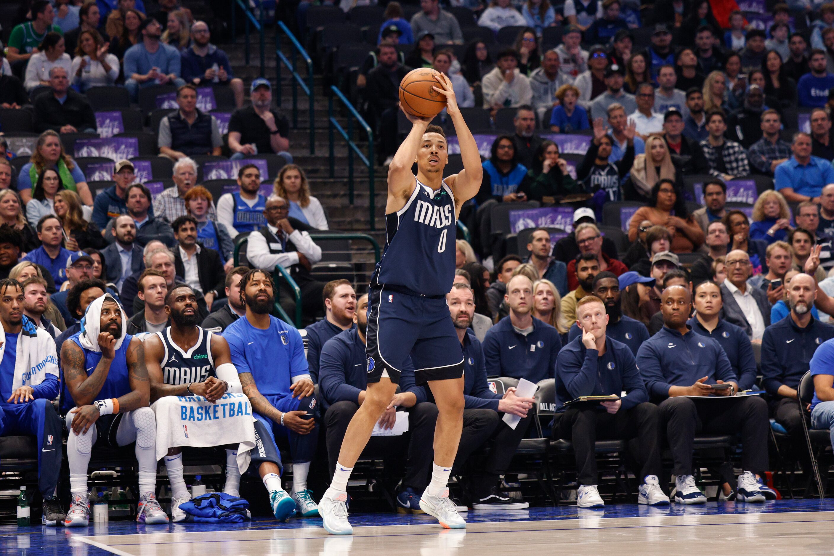 Dallas Mavericks guard Dante Exum (0) shoots a wide open three-pointer during the first half...