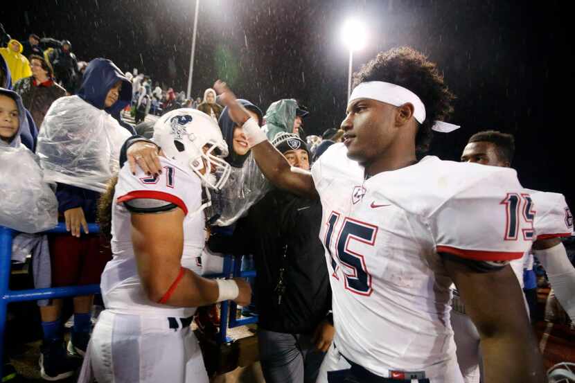 Allen running back Brock Sturges (15) congratulates Misi Tupou (31) on their win over San...