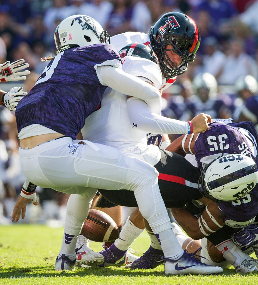 Texas Tech quarterback Patrick Mahomes II fumbles as he is sacked by TCU defensive end Mat...