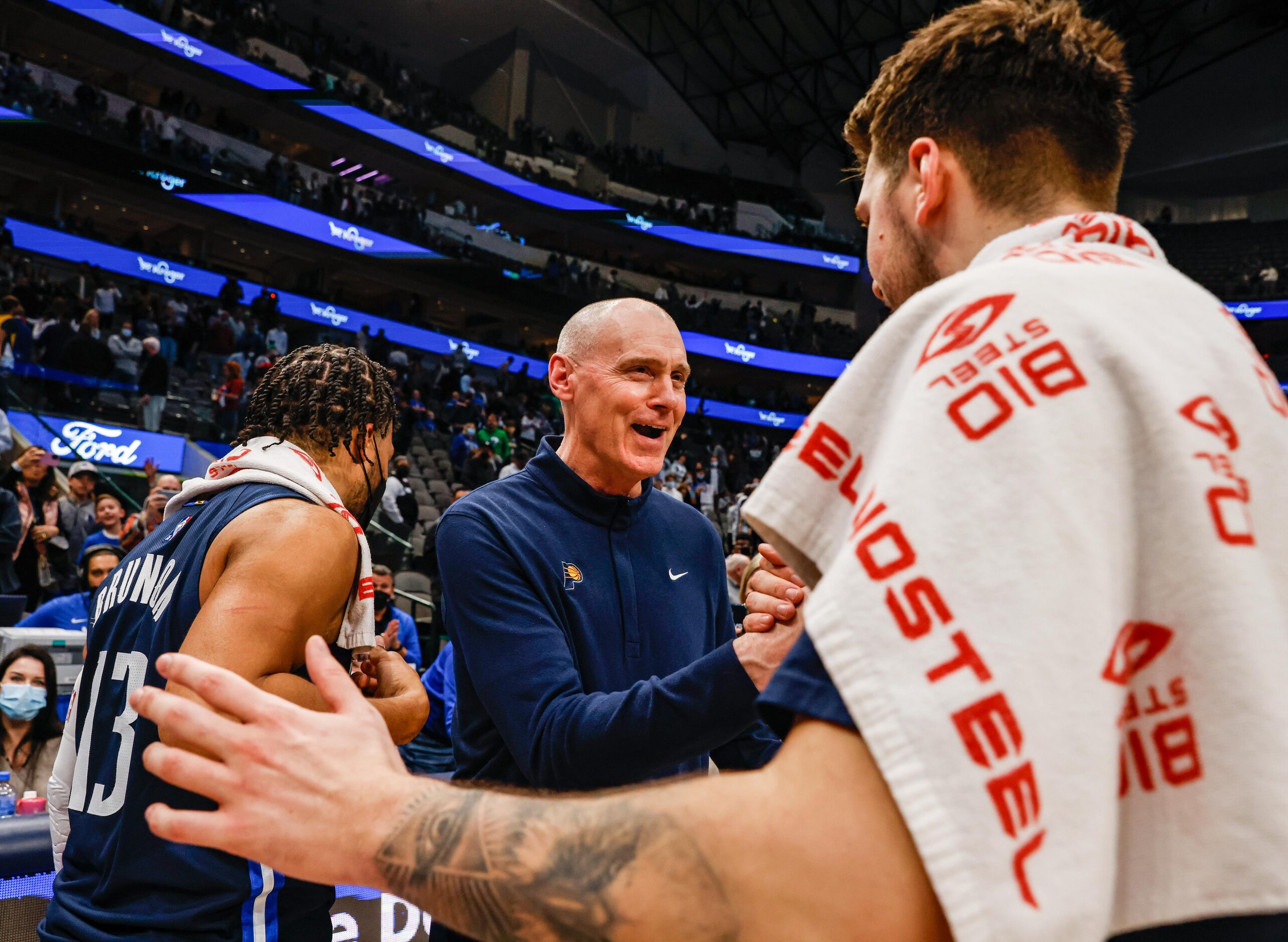 Indiana Pacers coach Rick Carlisle greets Dallas Mavericks guard Luka Doncic (77) after the...