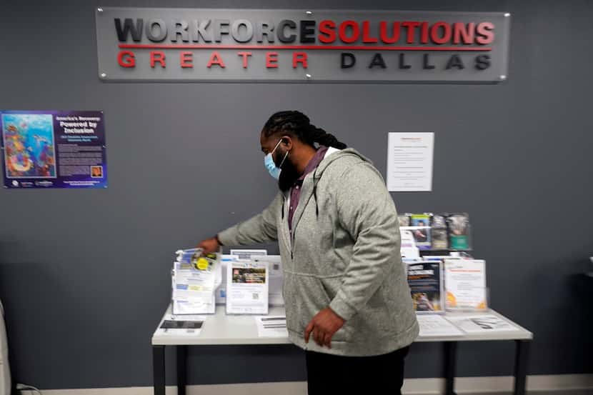 Texas Workforce Commission talent engagement specialist Anthony Crosby adjusts job...