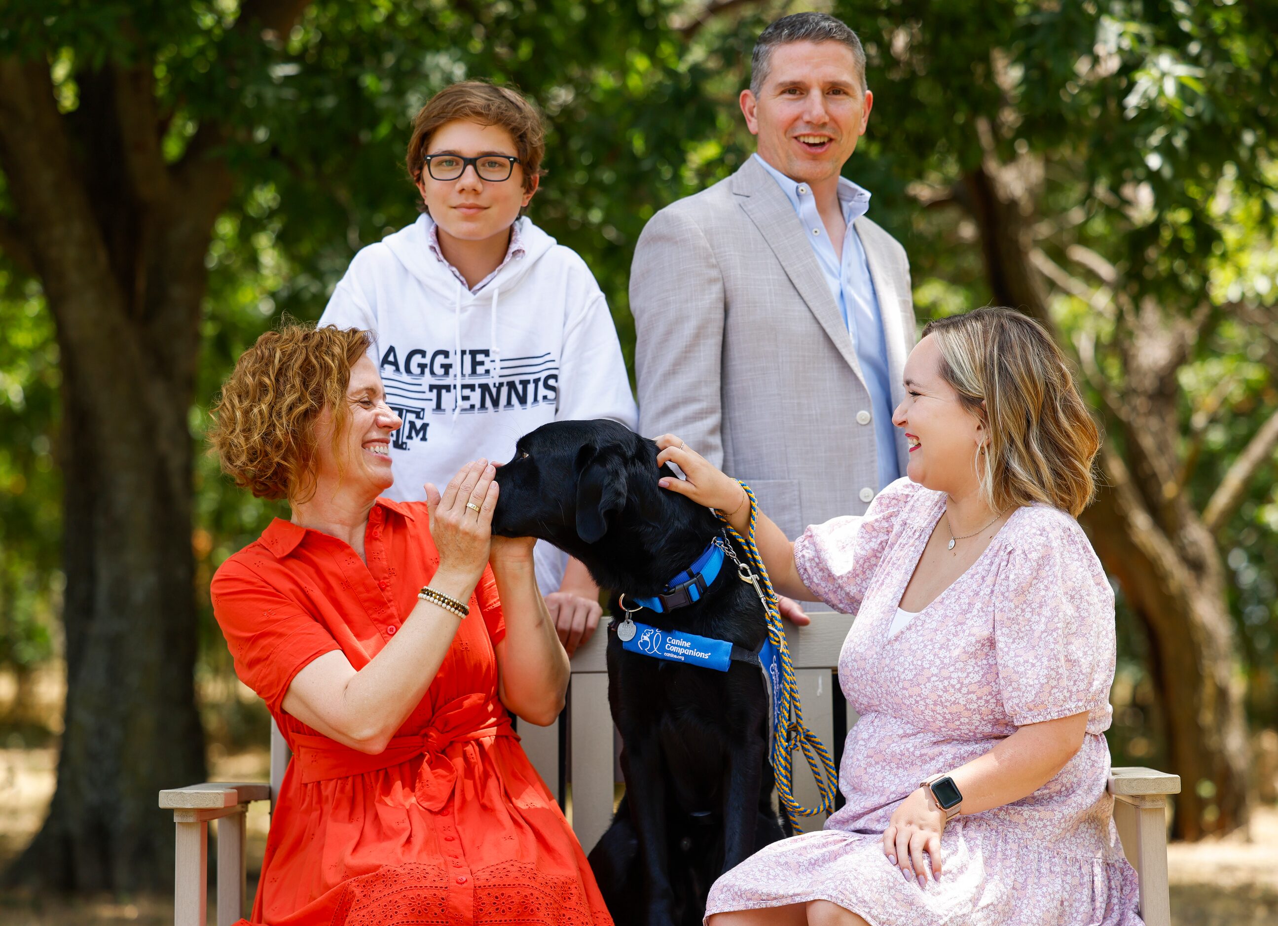 Puppy raiser Michaela Durisek (front left), her son Sebastian (back left), husband Nick...