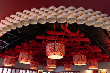 Bamboo steamer baskets and patterned lights line the ceiling at MiYa Chinese in Dallas.