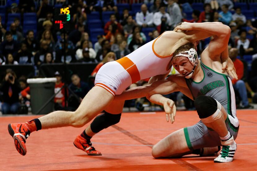 Arlington Bowie's Taylor Parks and Southlake Carroll's Cameron Haddock wrestle during the...