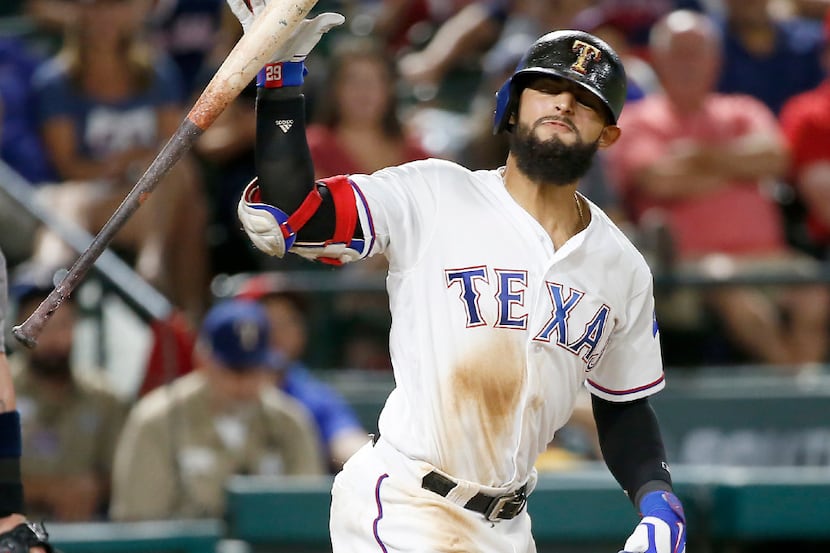 Texas Rangers second baseman Rougned Odor (12) reacts after being hit by a pitch during the...