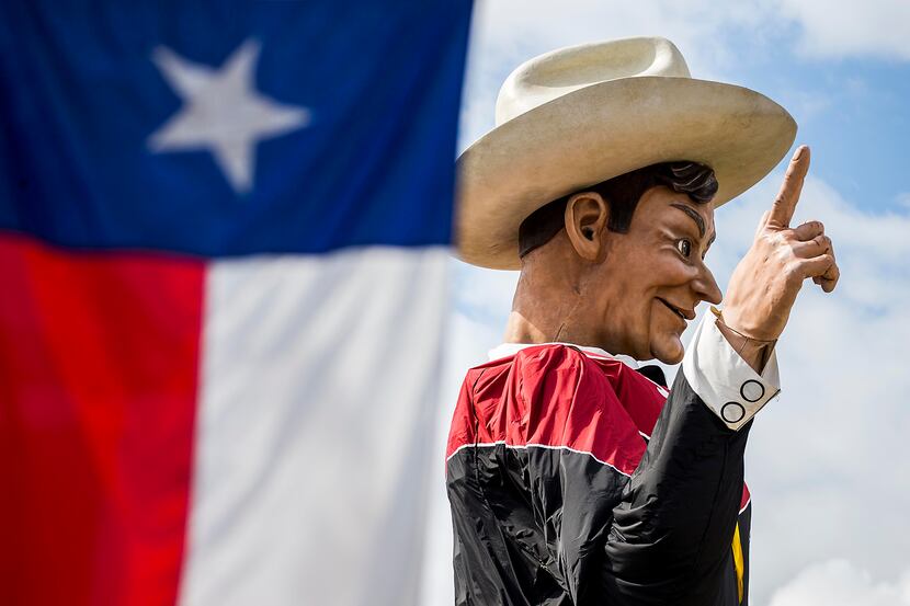 Big Tex looks down over Fair Park while being installed on Friday, Sept. 23, 2016, in...