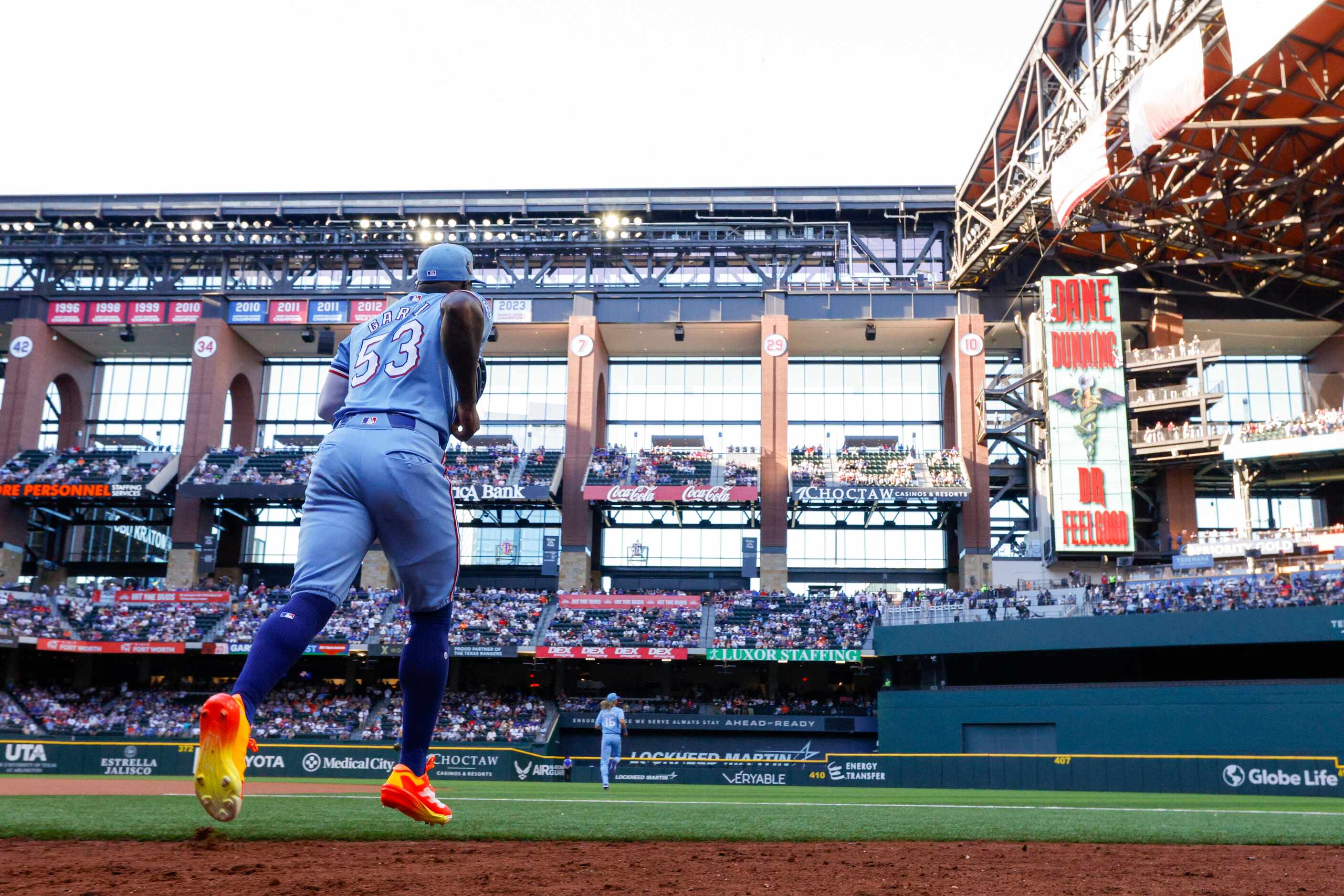 Texas Rangers right fielder Adolis García takes the field before the first inning against...