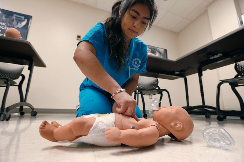 Kimberly Cruzalta practices CPR on an infant during the RISD Health Science program at...