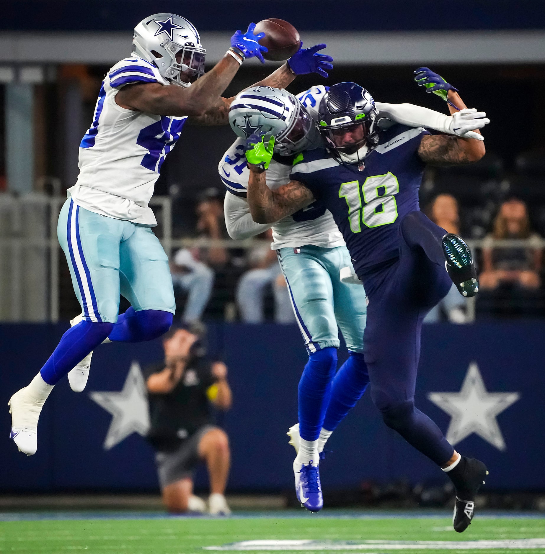 Dallas Cowboys safetys Tyler Coyle (31) and Juanyeh Thomas (40) break up a pass intended for...