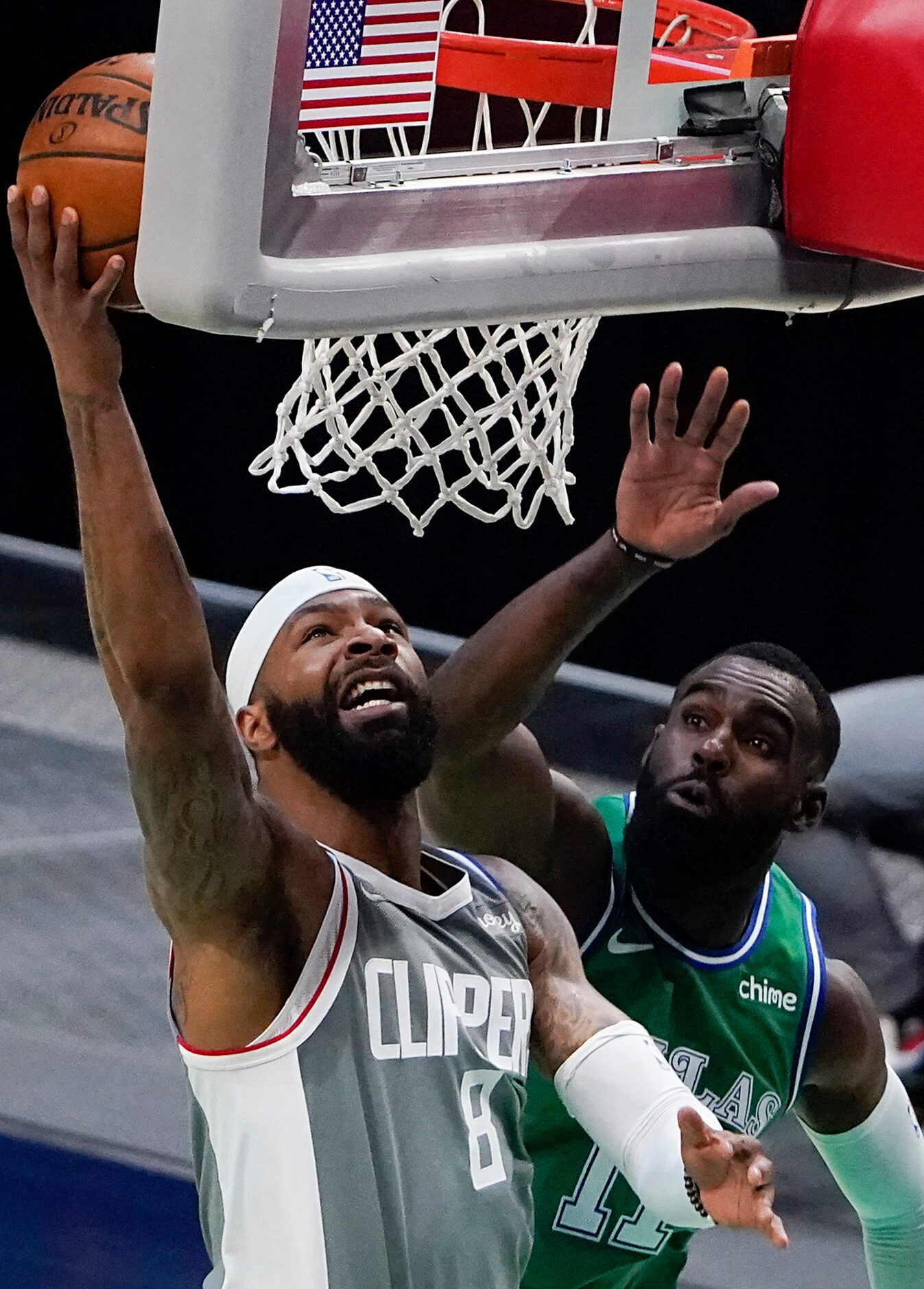 LA Clippers forward Marcus Morris Sr. (8) shoots past Dallas Mavericks forward Tim Hardaway...