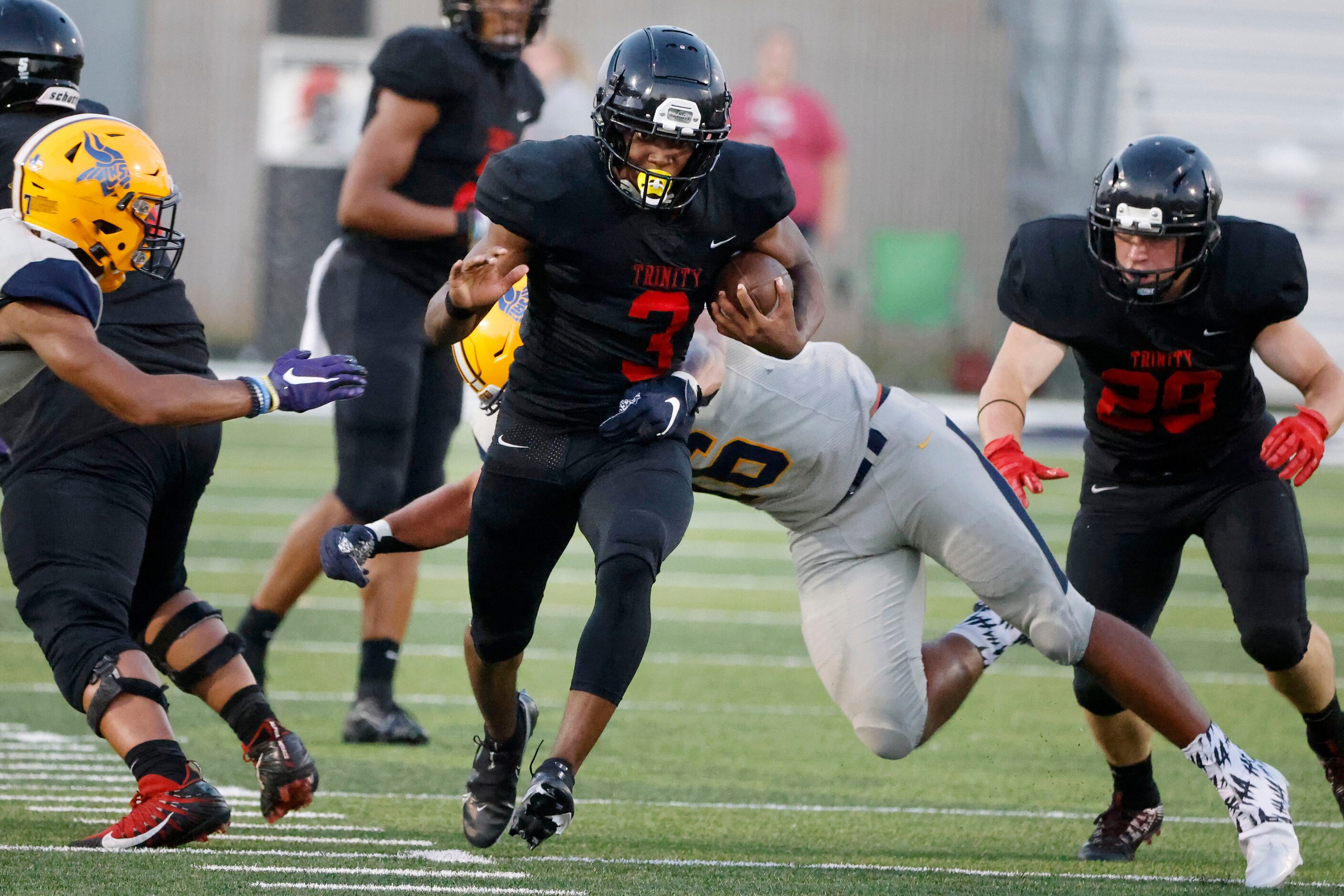 Arlington Lamar running back Garry Madox (3) runs out of an attempted tackle by Arlington...