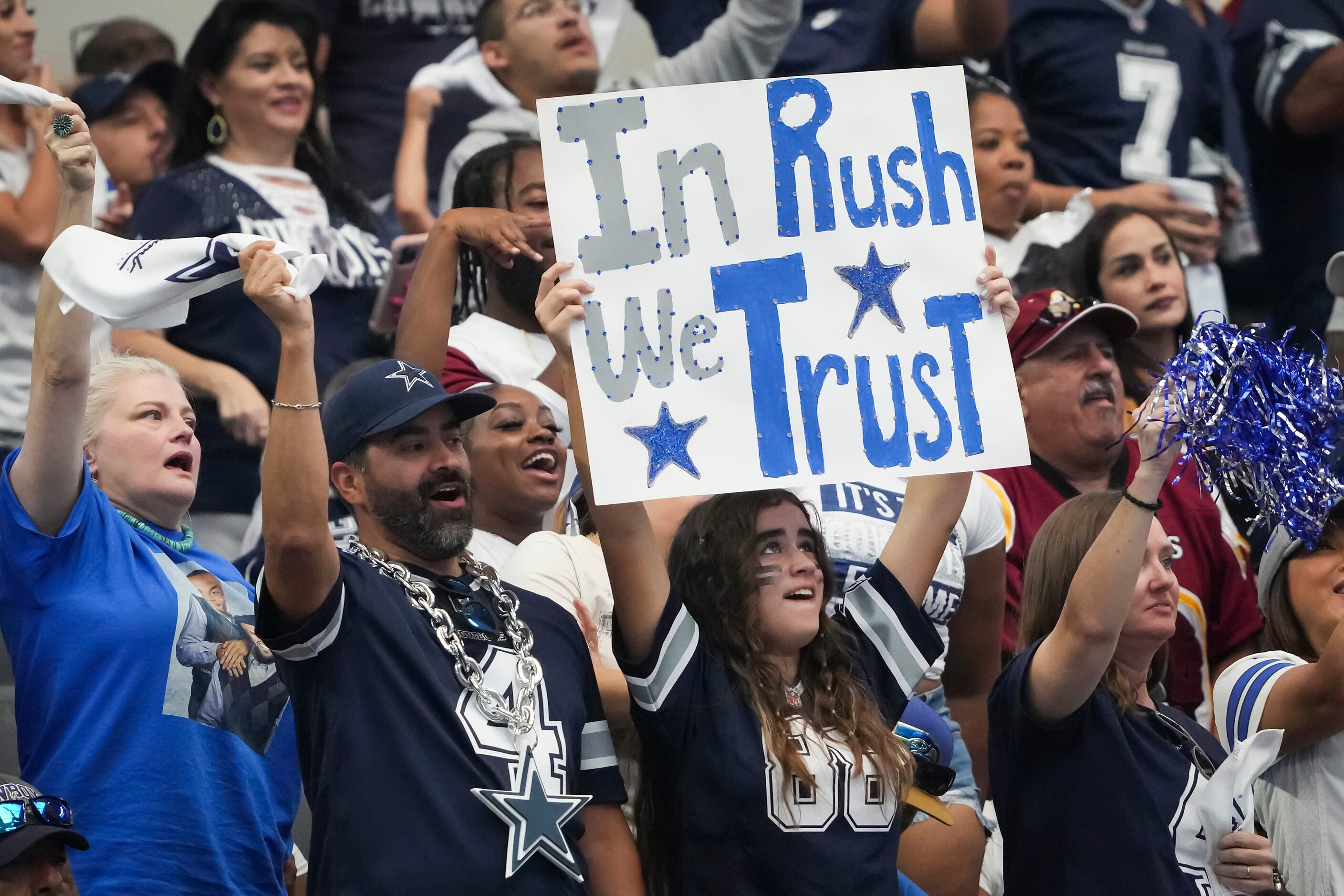 Dallas Cowboys fans cheer quarterback Cooper Rush during the first half of an NFL football...