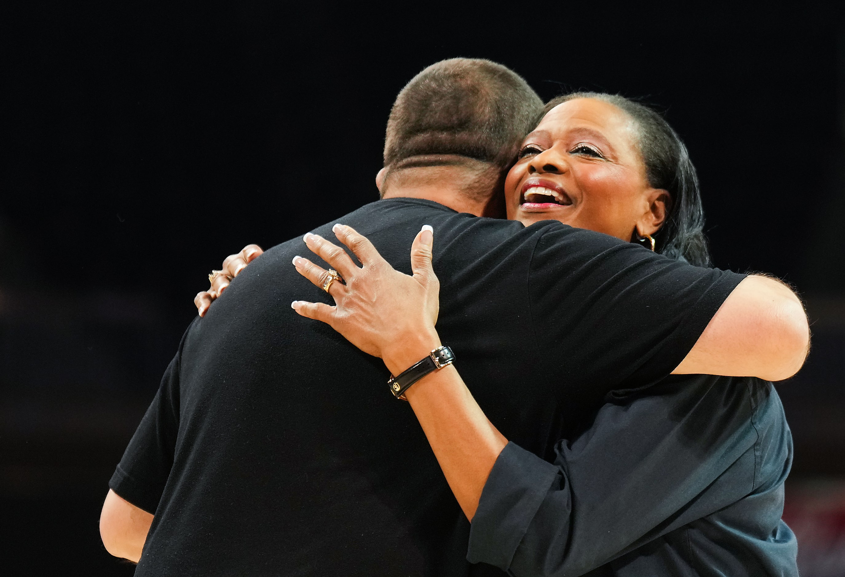 Dallas County Sheriff Marian Brown hugs DISD Police Chief Albert Martinez during halftime of...