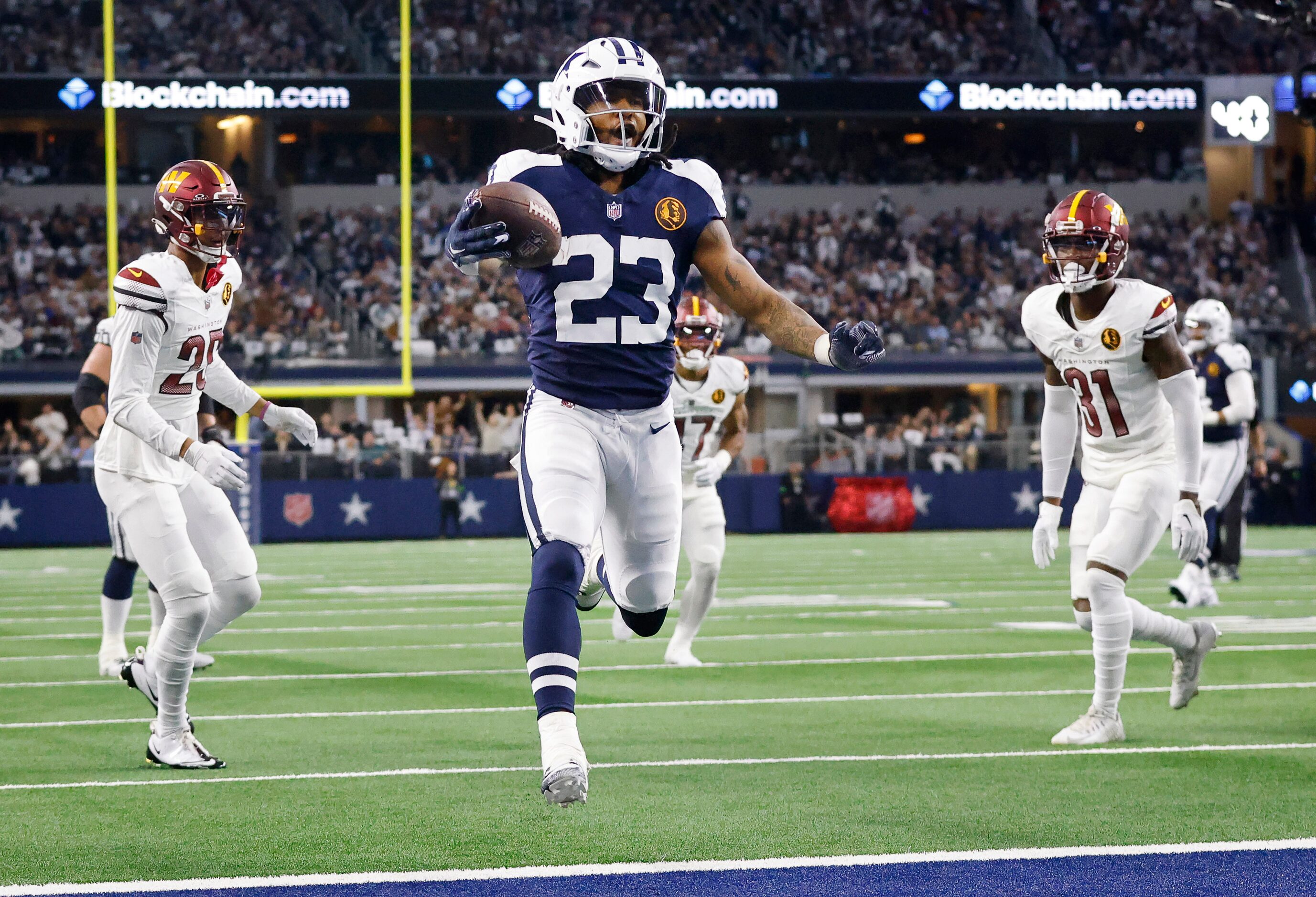 Dallas Cowboys running back Rico Dowdle (23) runs in for a first quarter touchdown against...