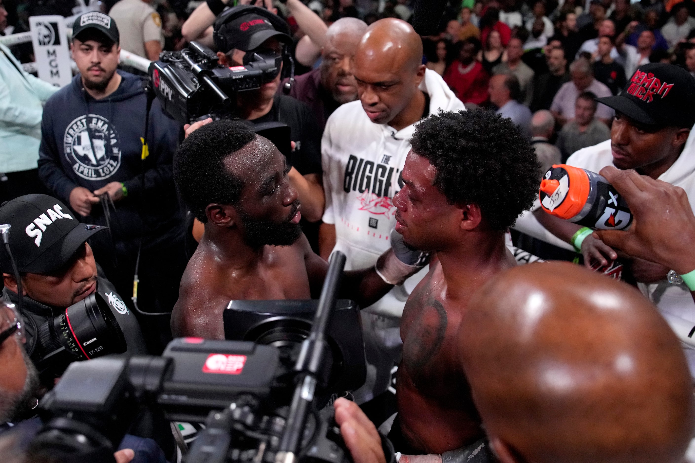 Terence Crawford, left, talks with Errol Spence Jr. fight after Crawford won their...