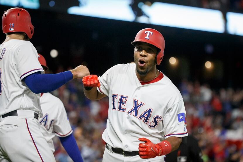 Texas Rangers shortstop Elvis Andrus celebrates after hitting a 3-run home run to tie the...