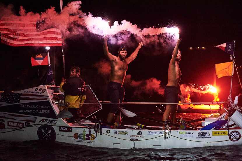 After their history-making row across the Atlantic Ocean, the team members fired flares in...