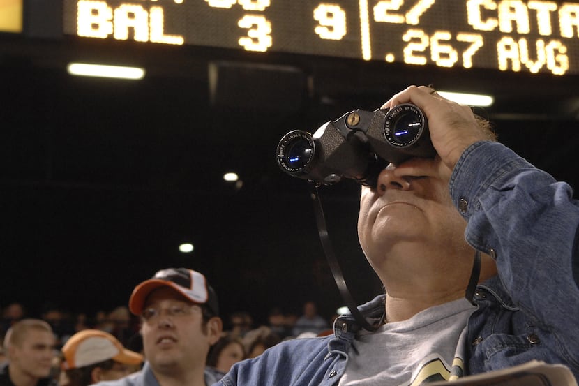 ORG XMIT: *S0420798556* Tom Stevens of Millersville uses his binoculars to get a closer look...