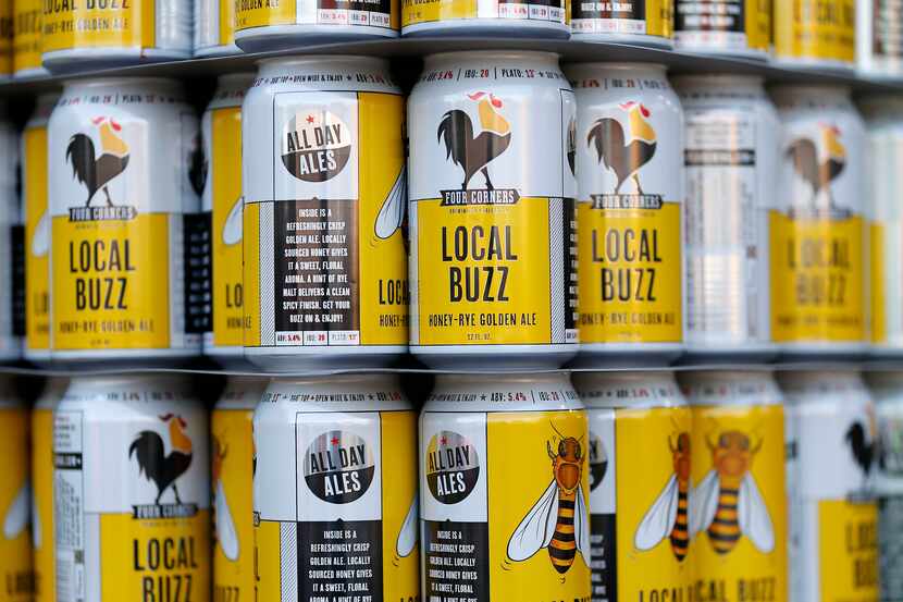 Empty cans for Four Corners' Local Buzz brewed as an Golden Ale style beer wait to be filled...