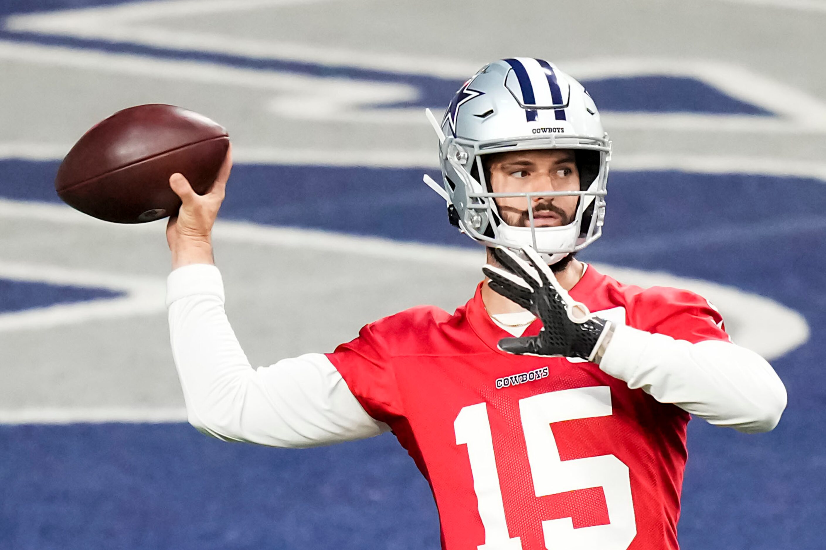 Dallas Cowboys quarterback Will Grier throws a pass during the OTA team's practice at The...