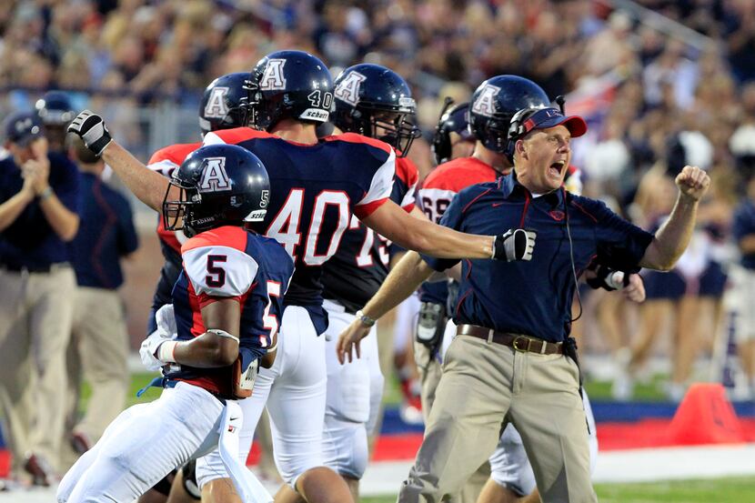 An Allen coach and players celebrate as Southlake Carroll missed a first-quarter field goal....