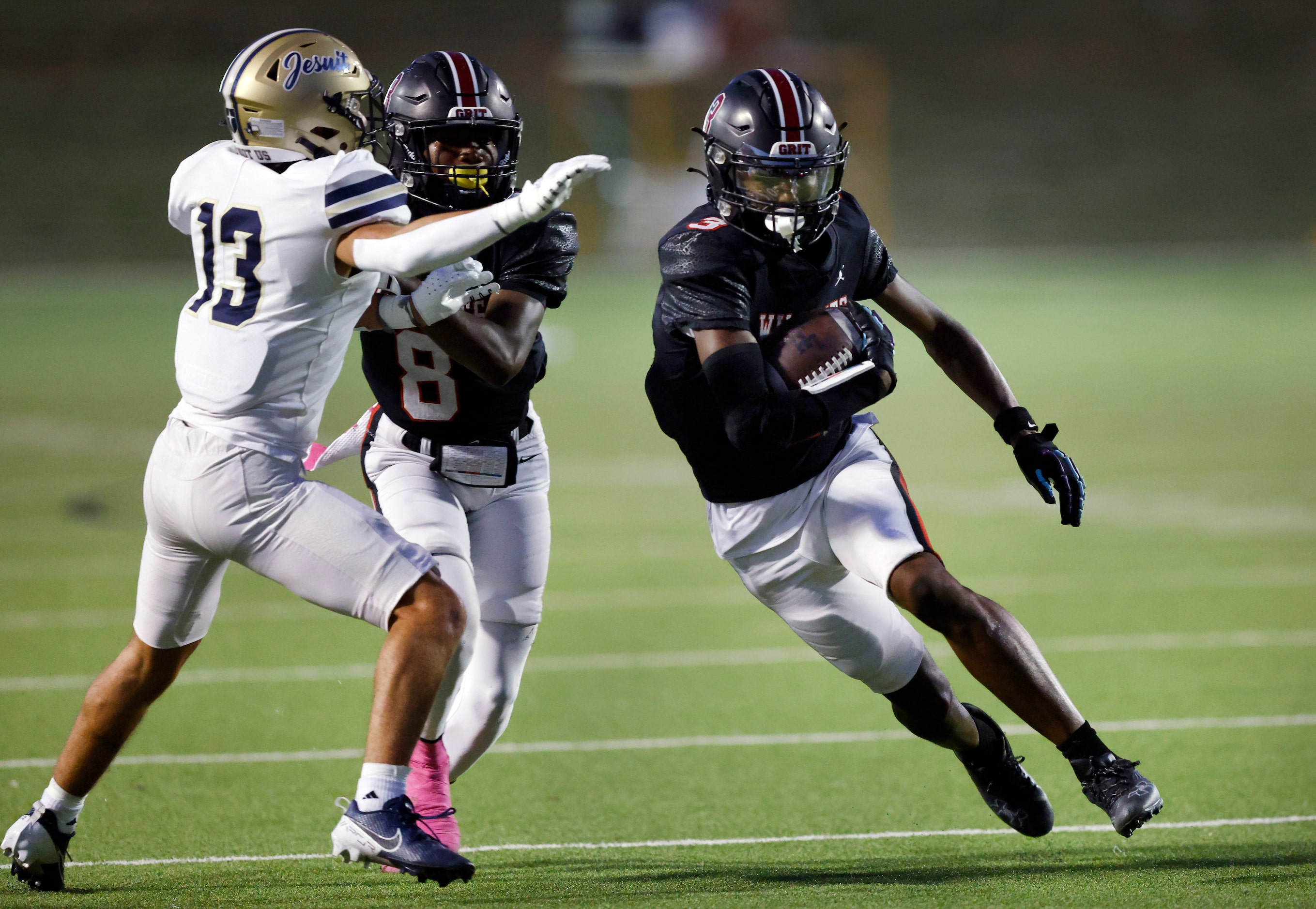 Lake Highlands High wide receiver De'anthony Flagge (3) gets a block form Mo Kamara (8) on...