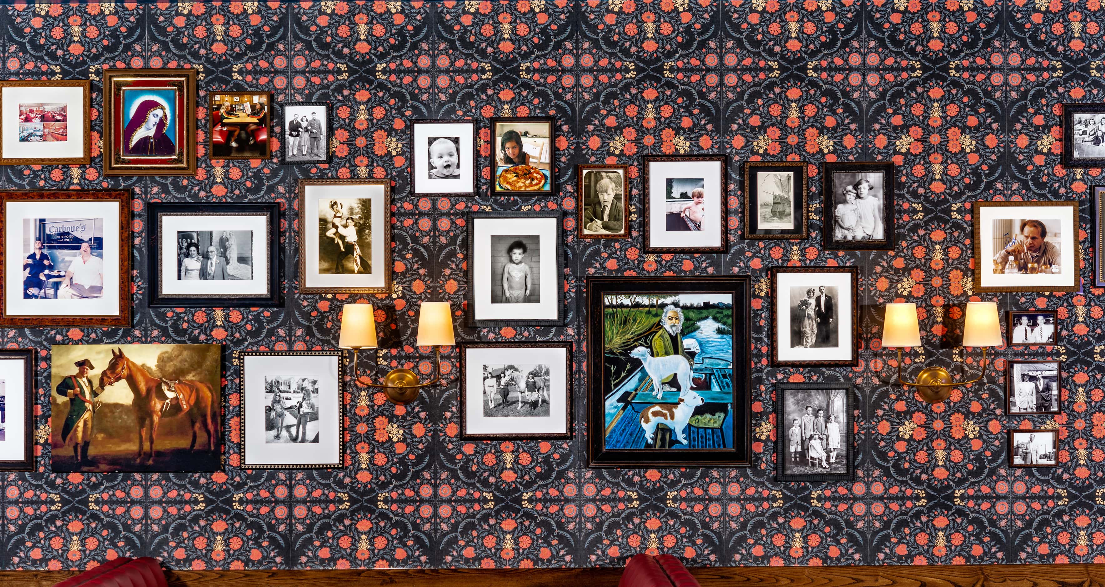Owner Julian Barsotti plans to add to this wall when he has other framed photos or art to...