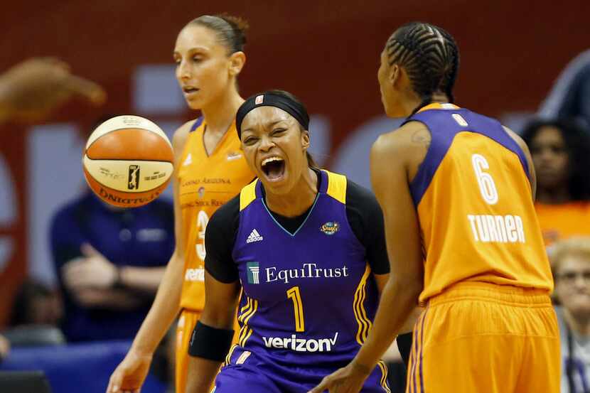 Los Angeles Sparks guard Odyssey Sims (1) celebrates a basket against the Phoenix Mercury in...
