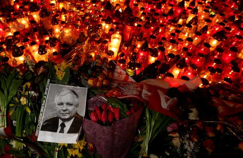 A portrait of late Polish President Lech Kaczynski lies among a sea of candles and flowers...