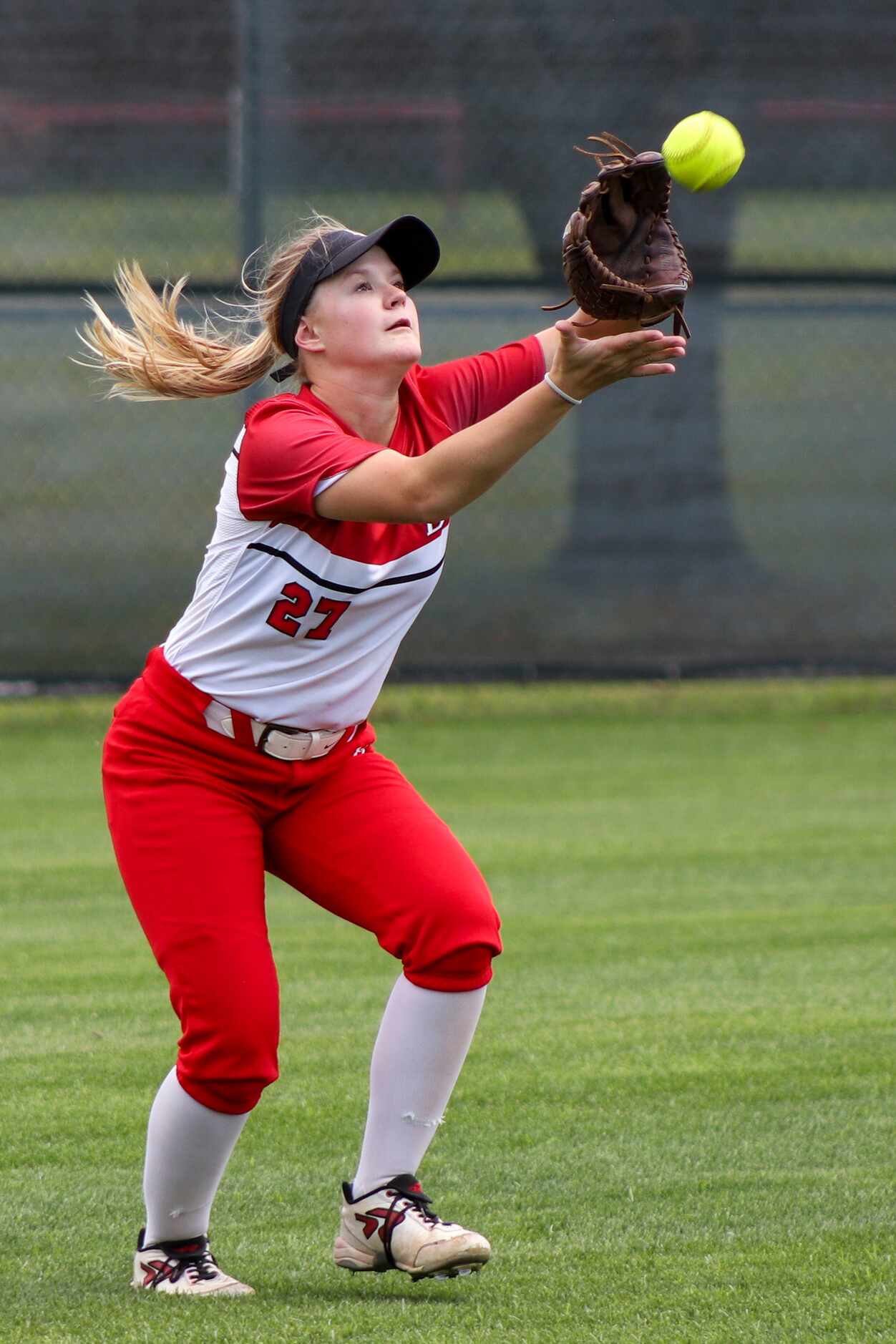 Mansfield Legacy outfielder Ashlyn Rushing (27) catches the ball for an out during a...