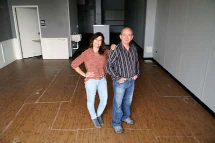 Lisa and Kyriakos Kouzoukas pose at the home of their future bagel shop in Richardson.