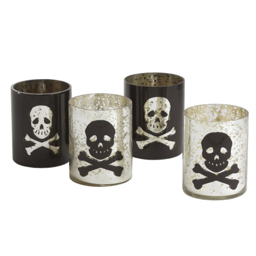 Eerie light Skull and crossbones votive holders of silvered glass are perfect as a hostess...