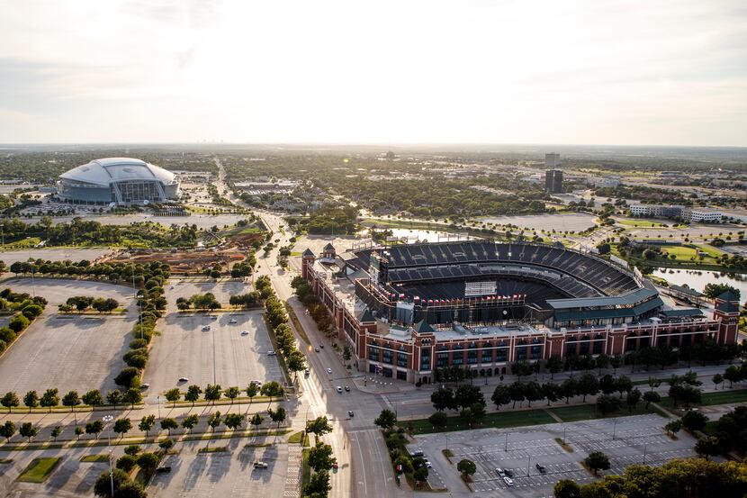 Globe Life Park (right) and AT&T Stadium (top, left) are seen with construction on the Texas...