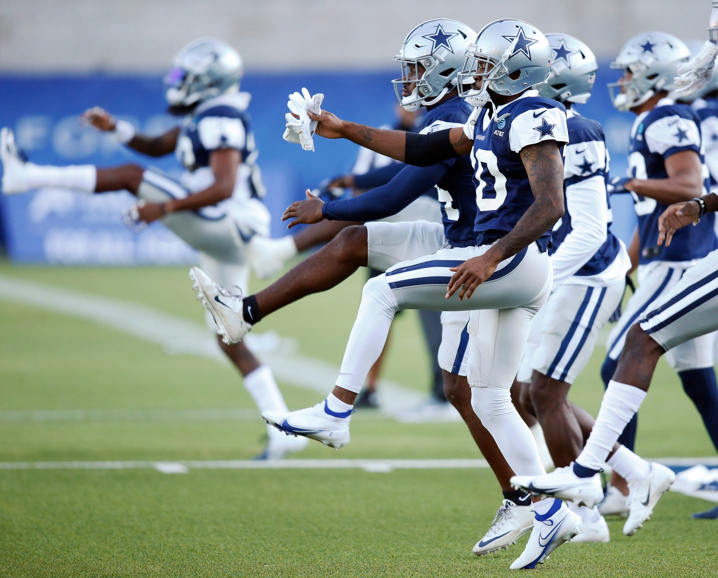 Dallas Cowboys cornerback Anthony Brown (30) stretches with teammates in practice during...